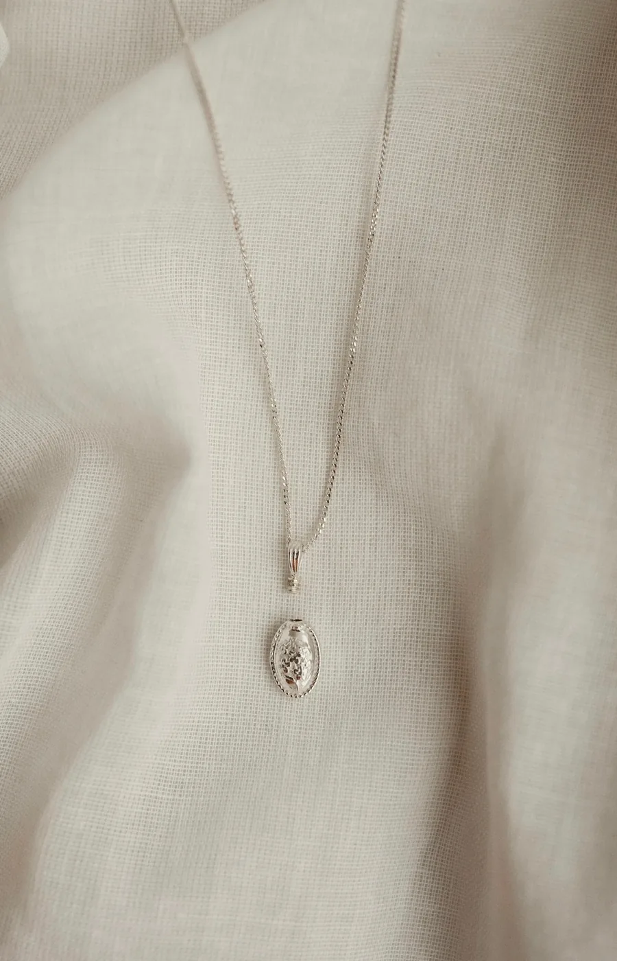 Forget-Me-Not Oval Cremains Urn Necklace - Sterling Silver — product image 1