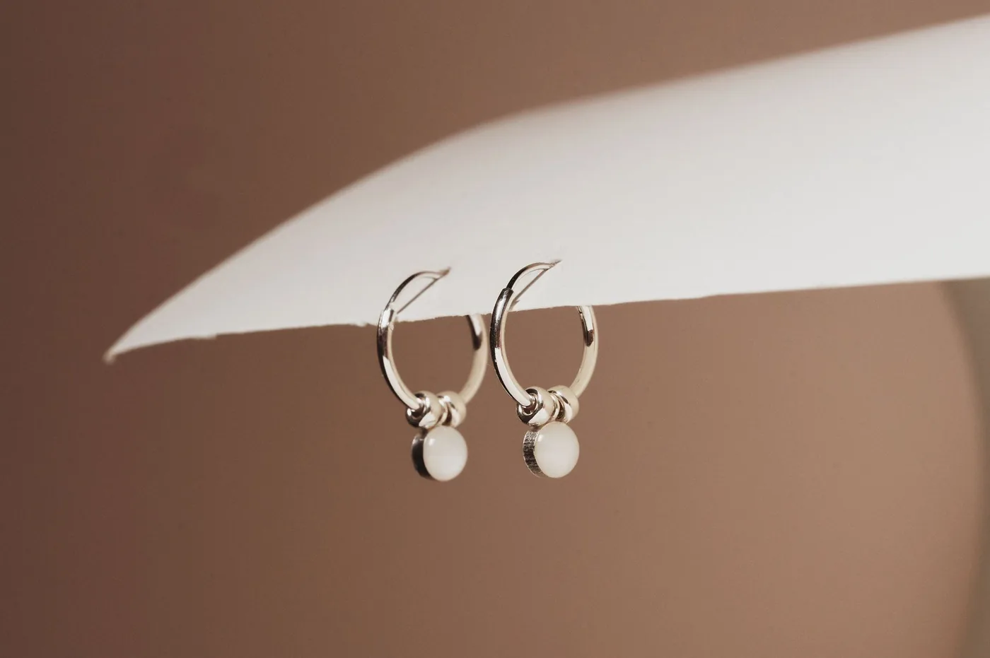 Mothers Milk Huggie Hoop Earrings - Sterling Silver — product image 1